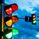Traffic lights over urban intersection. Red light