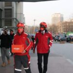 James-Kimonyo-rode-a-delivery-bike-to-an-online-customer-in-China