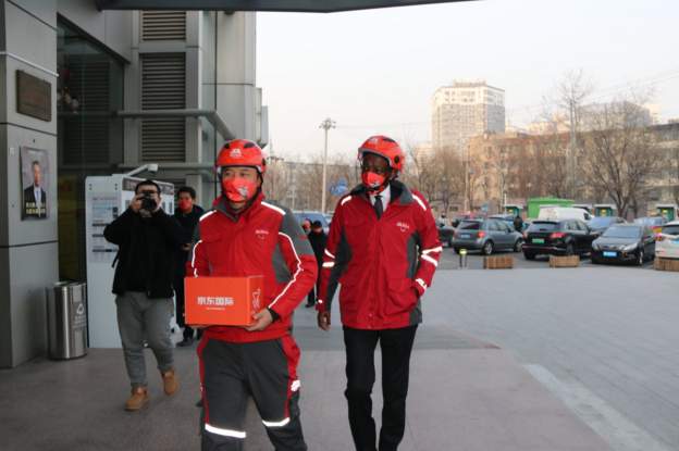 James-Kimonyo-rode-a-delivery-bike-to-an-online-customer-in-China