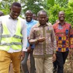 Cocoa-Farms-Mr.-Amamo-Antwi-conducting-Mr-Aidoo-middle-and-Fiifi-Boafosecond-rtDeputy-Director-Public-Affairs-COCCOBOD-round-the-Kumikrom-rehabilitation-cocoa-farm.