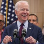 Joe-Biden-meets-African-American-woman-1-696x473