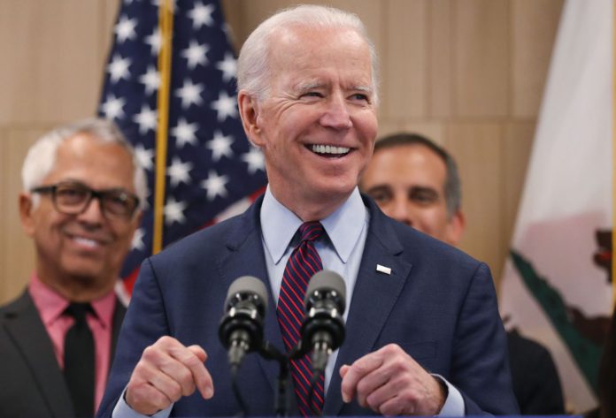 Joe-Biden-meets-African-American-woman-1-696x473