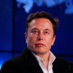 Musk looks on at SpaceX Falcon 9 post-launch news conference in Cape Canaveral